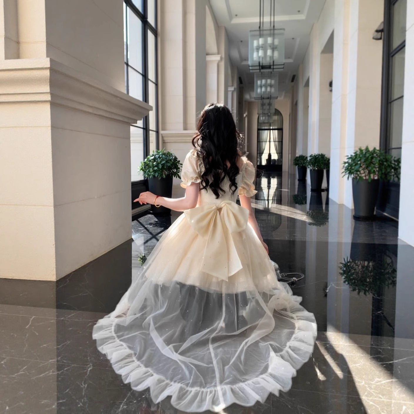 Puffy Sequined Ball Gown With A Large Bow Jacquard Design And A Trailing Skirt